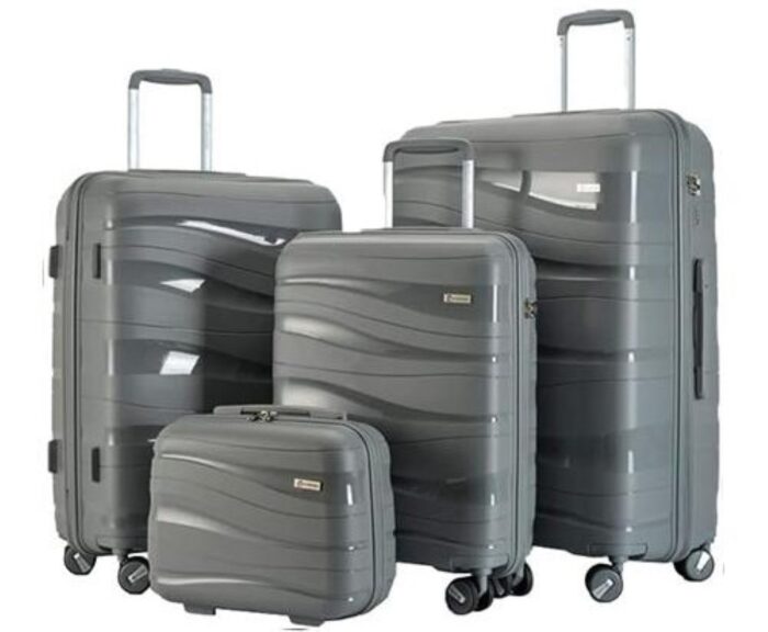 Suitcase packed with clothing, toiletries, and travel essentials ready for a trip
