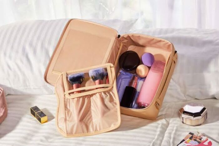 Organized travel makeup bag with separate compartments for beauty products.