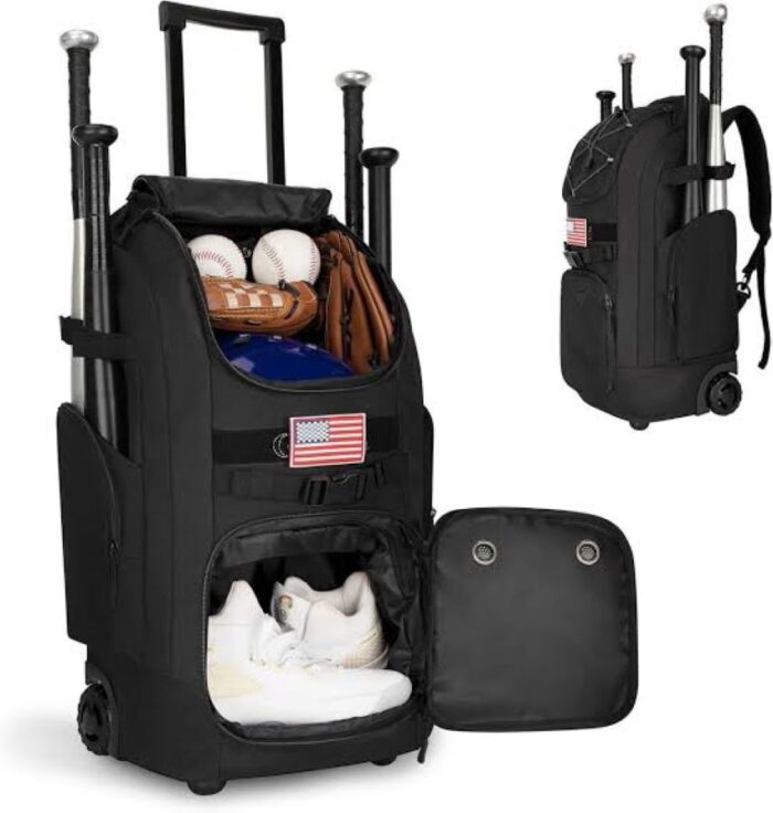 Rolling baseball bag packed with bats, helmet, gloves, and cleats for travel.